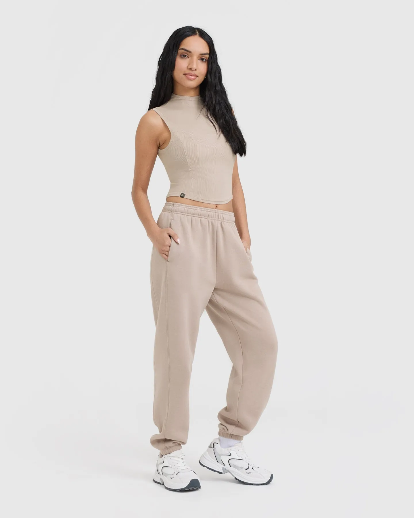Sure! Here’s an optimized title for the e-commerce product:

Cozy Mushroom Brown Mellow Ribbed Mid Mock Neck Tank Top for Effortless Style