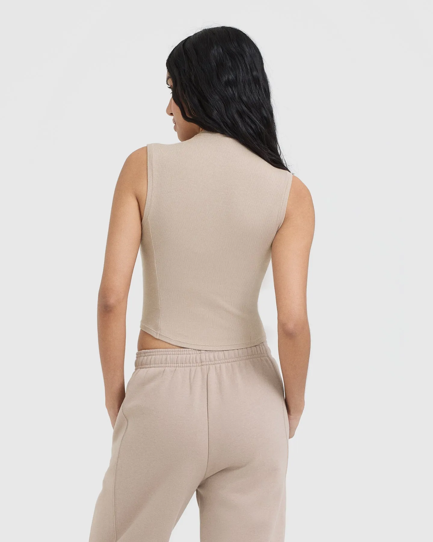Sure! Here’s an optimized title for the e-commerce product:

Cozy Mushroom Brown Mellow Ribbed Mid Mock Neck Tank Top for Effortless Style