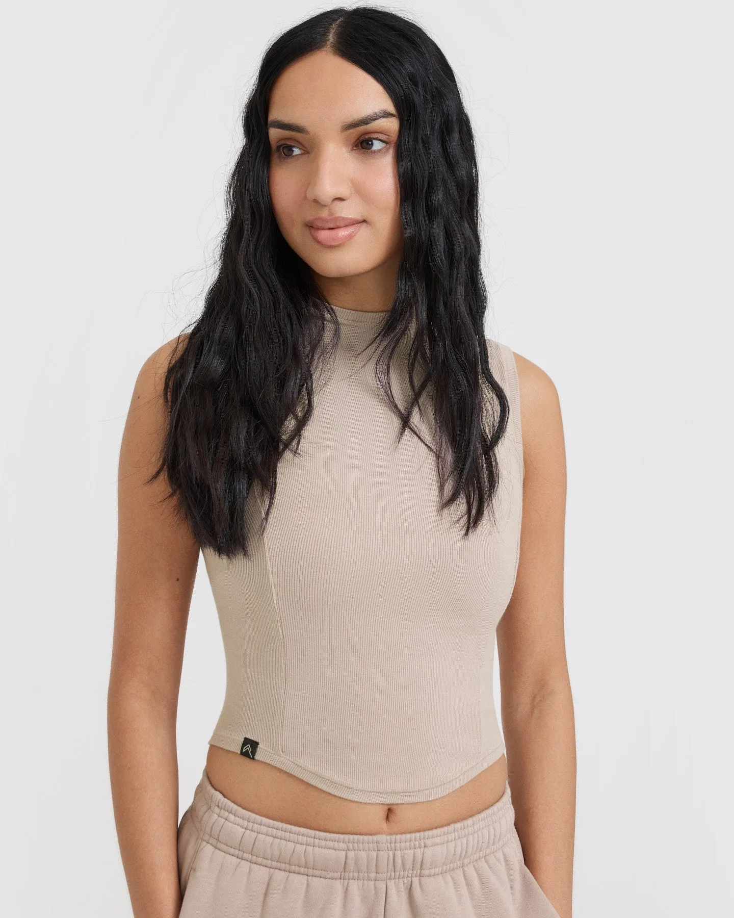Sure! Here’s an optimized title for the e-commerce product:

Cozy Mushroom Brown Mellow Ribbed Mid Mock Neck Tank Top for Effortless Style